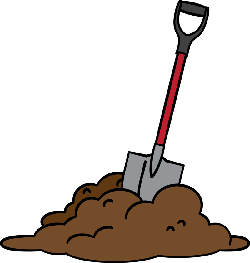 a shovel stuck in a pile of dirt