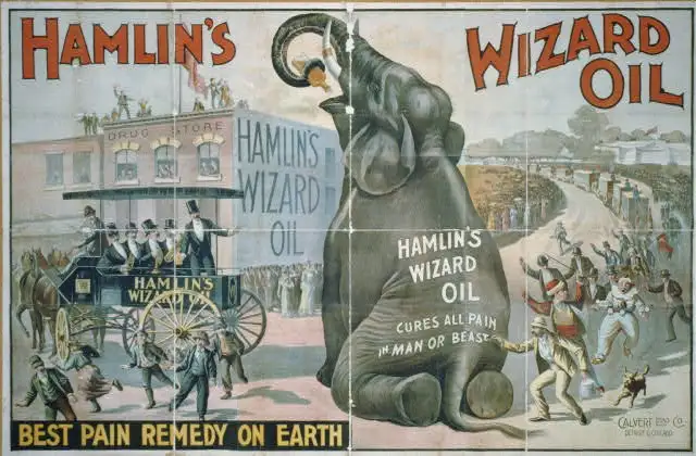 old advertisement for hamlin's wizard oil. For some inexplicable reason there is a giant elephant in the middle of a street, with a man followed by two clowns painting the words Hamlin's wizard oil - cures all pain in man or beast on the elephant's back. A strange and chaotic parade is also happening on the street for no clear reason.